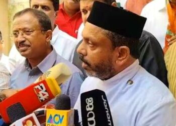 Image: Fr. Shaiju Kurien with Union Minister V. Muraleedhran