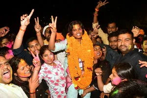 PATNA, MAR 30 (UNI):- ABVP candidate Maithili Mrinalini celebrates after winning the presidential post of Patna University Students Union (PUSU), in Patna on Sunday. UNI PHOTO-61U